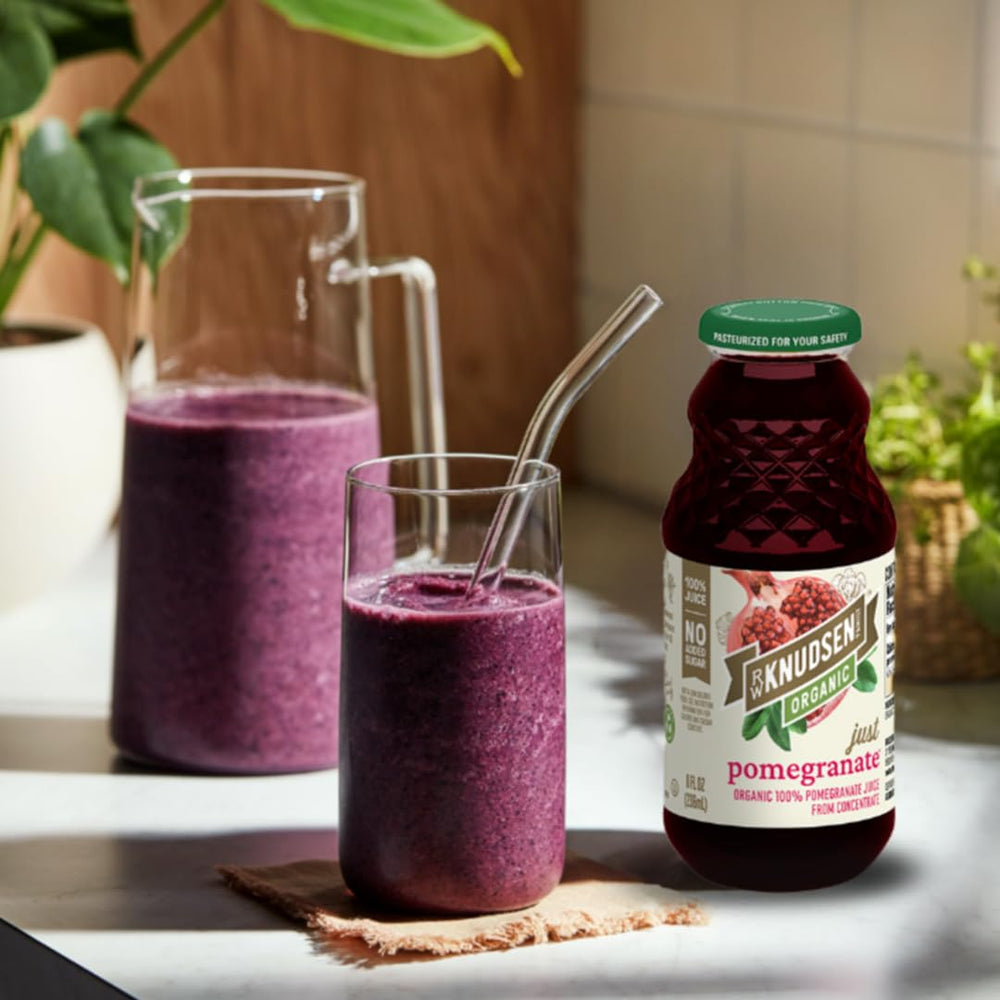 R.W. Knudsen Organic Pomegranate Juice in a glass, perfect for mocktails.