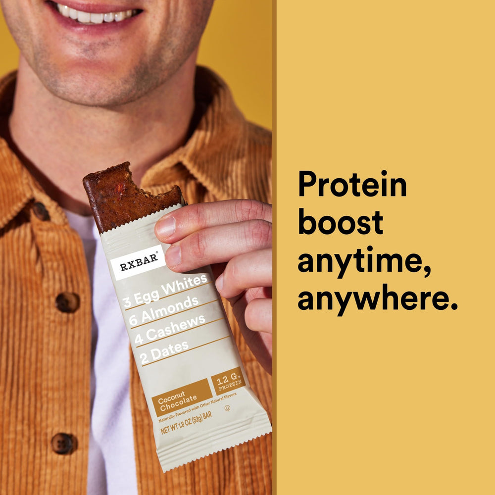 RXBAR Coconut Chocolate bar in hand for on-the-go fueling.