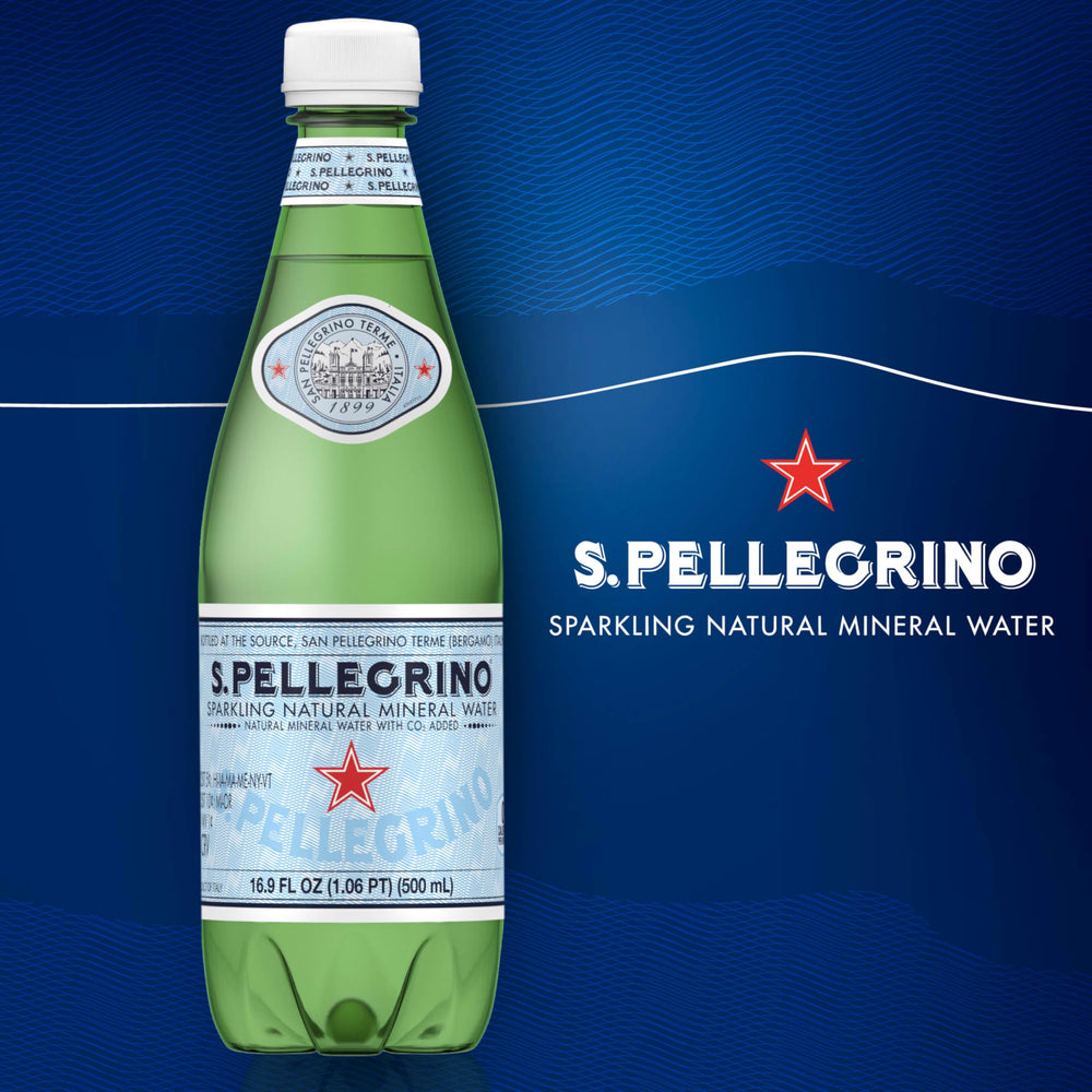 Close-up of S.Pellegrino bubbles in glass showing crisp effervescence.
