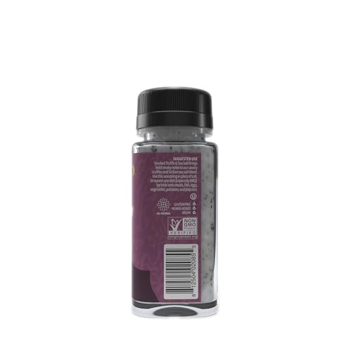 Sabatino Tartufi smoked truffle salt being poured over a juicy steak