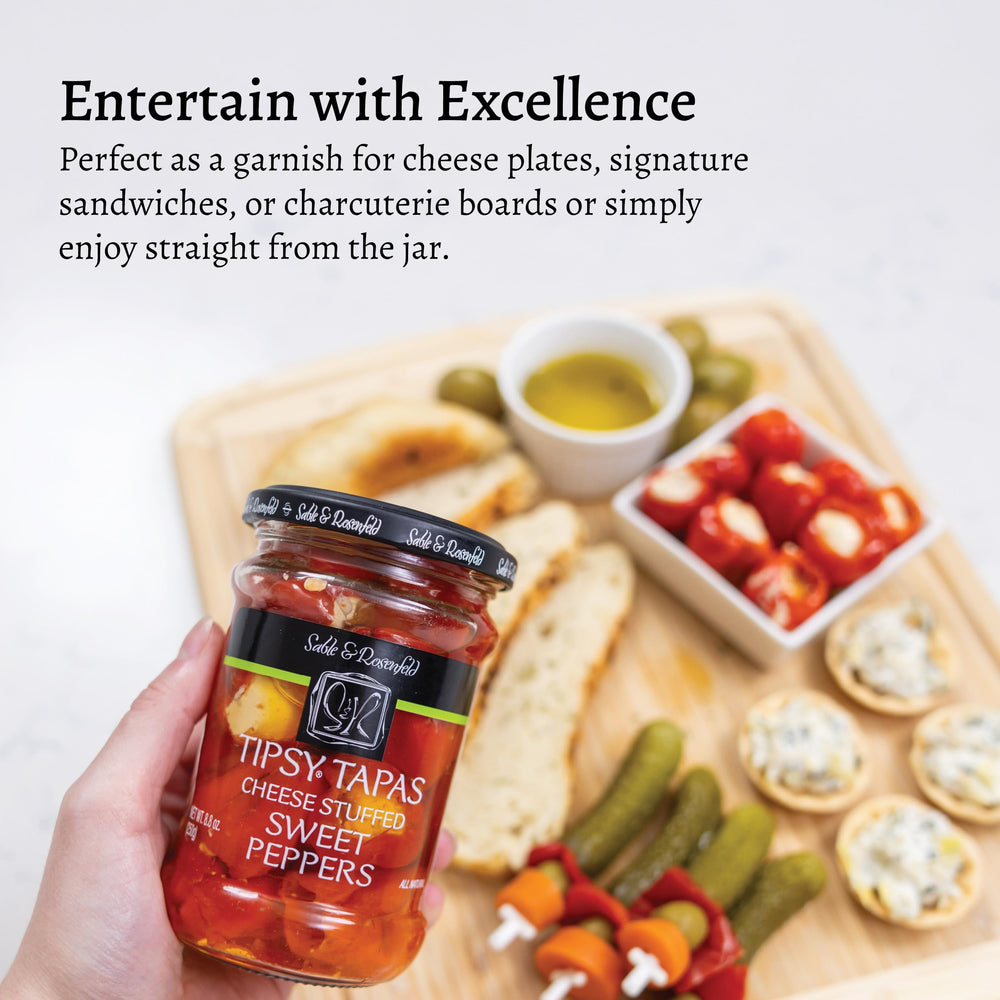 Peppers glistening in herb oil from Sable & Rosenfeld Tipsy Tapas for gourmet snacking.