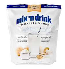 SACO Mix'n Drink bottle being poured for a refreshing skim milk experience.
