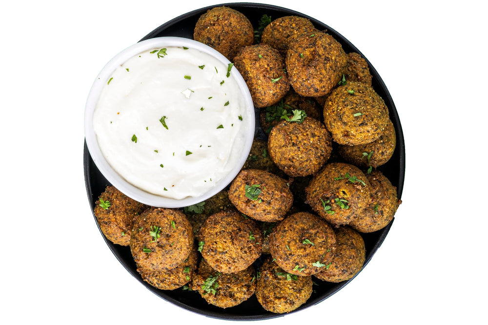 Sadaf Falafel Snack Platter ready to serve with hummus.