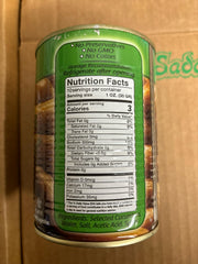 Sadaf pickled cucumbers in brine close-up, tangy flavor enhances sandwiches and meals.