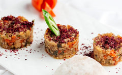 Sadaf Sumac Ground on a spice shelf shows versatile seasoning with citrusy notes.