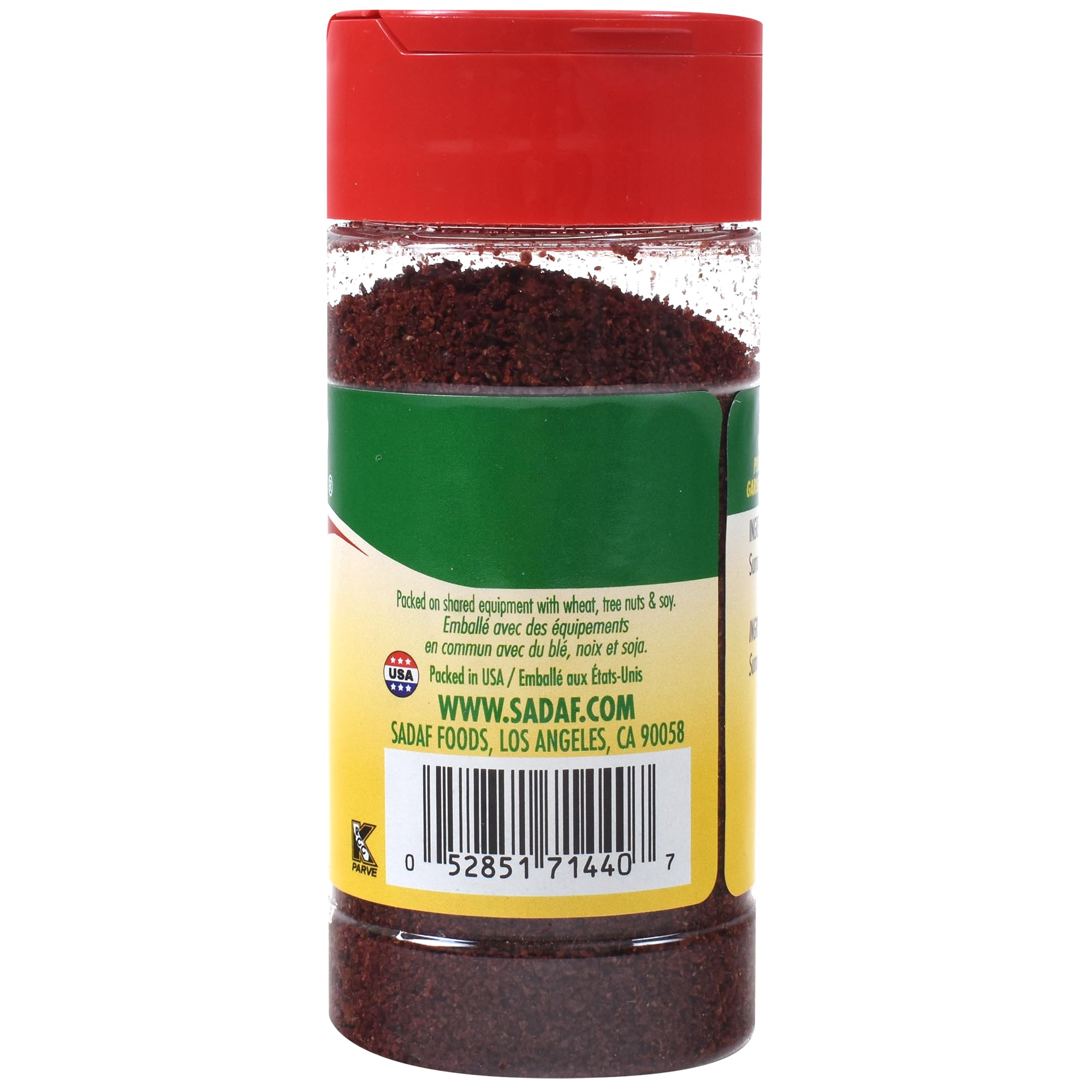 Sadaf Sumac powder on a spoon highlighting tart, citrus-like tang for dressings.