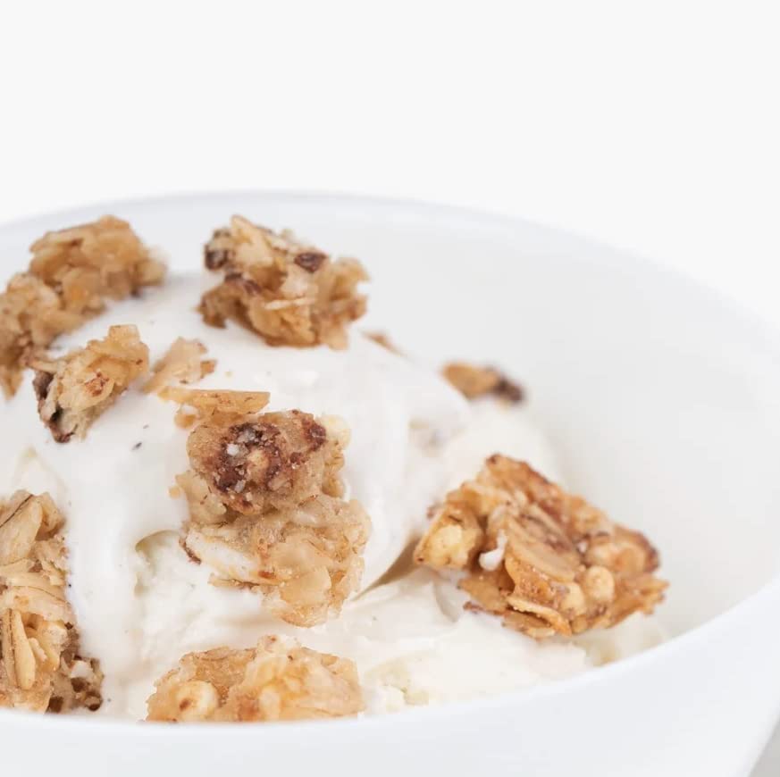 Dairy-free breakfast bowl featuring Safe + Fair granola and plant-based milk.