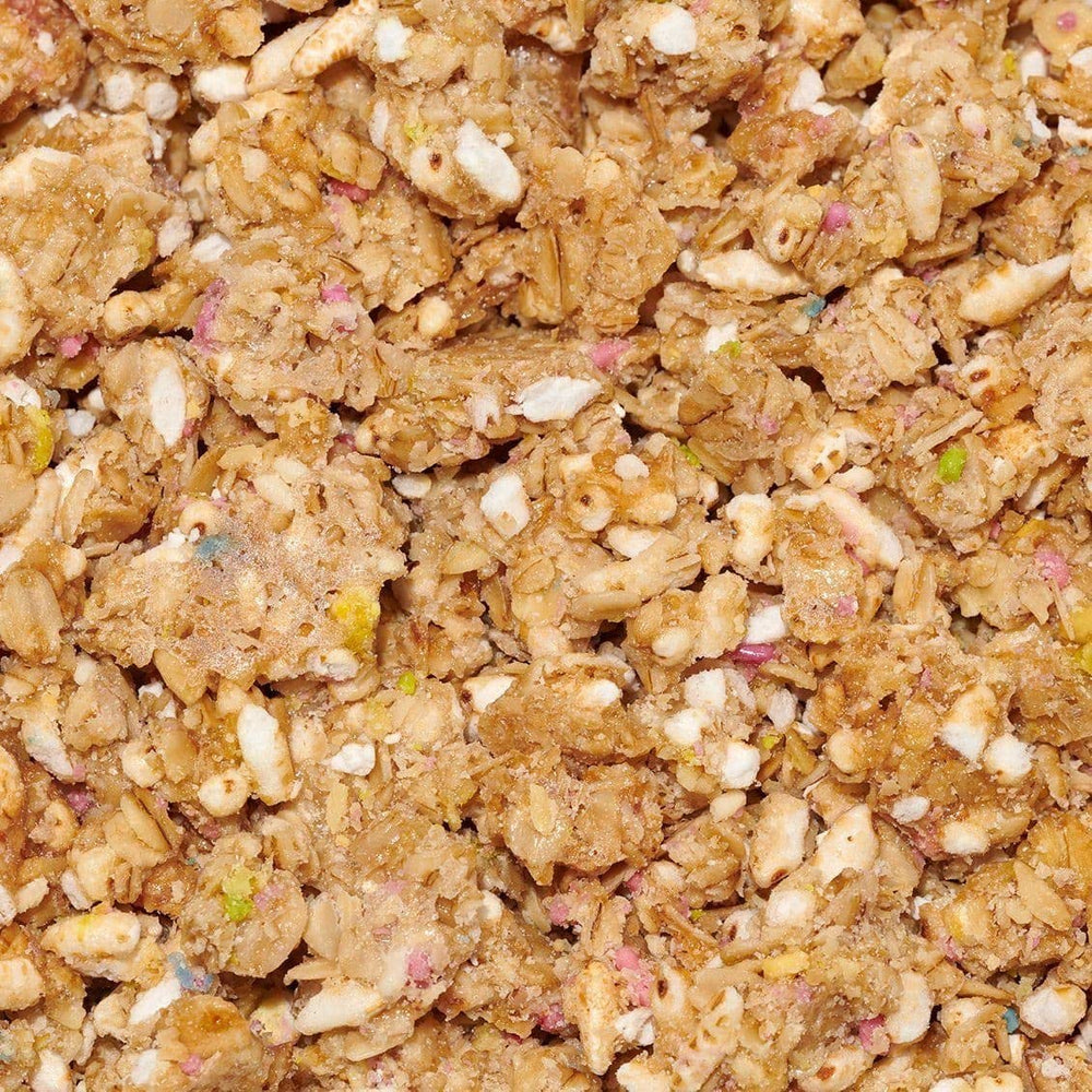 The Safe + Fair Birthday Cake Granola atop cereal for a crunchy morning meal.