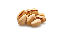 Salt crystals on Yupik pistachios signaling light seasoning
