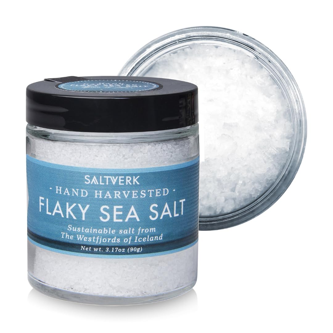 Saltverk sea salt flakes in a jar for crisp finishing and vibrant flavor.
