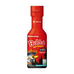 Samyang 2X Buldak sauce bottle close-up adds fiery flavor boost.