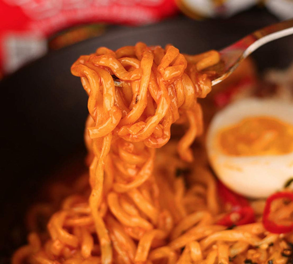 Samyang Bulldak Fire sauce pour in bowl for spicy dipping moments.