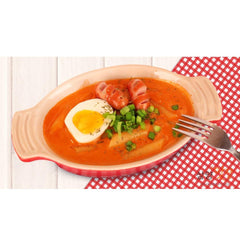 Samyang Carbo Buldak cooking step image with sizzling pan and spicy aroma.