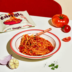 Close-up of SAMYANG linguine texture showing firm bite and sauce adhesion.