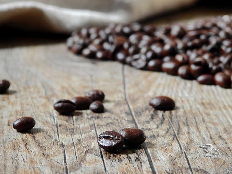 Pouring San Francisco Bay French Roast; rich, smoky aroma enhances bold morning cup.