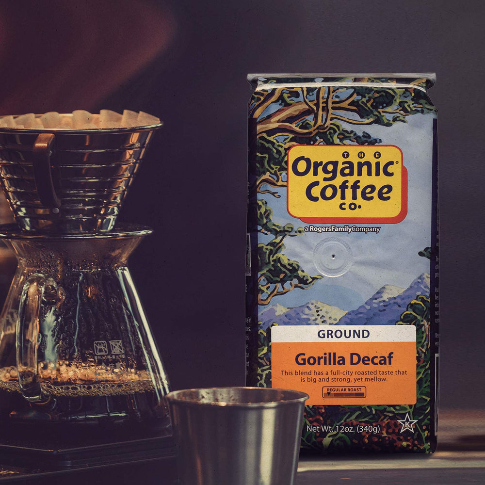 SAN FRANCISCO BAY Gorilla Decaf bag beside a coffee grinder, highlighting Swiss Water Process.