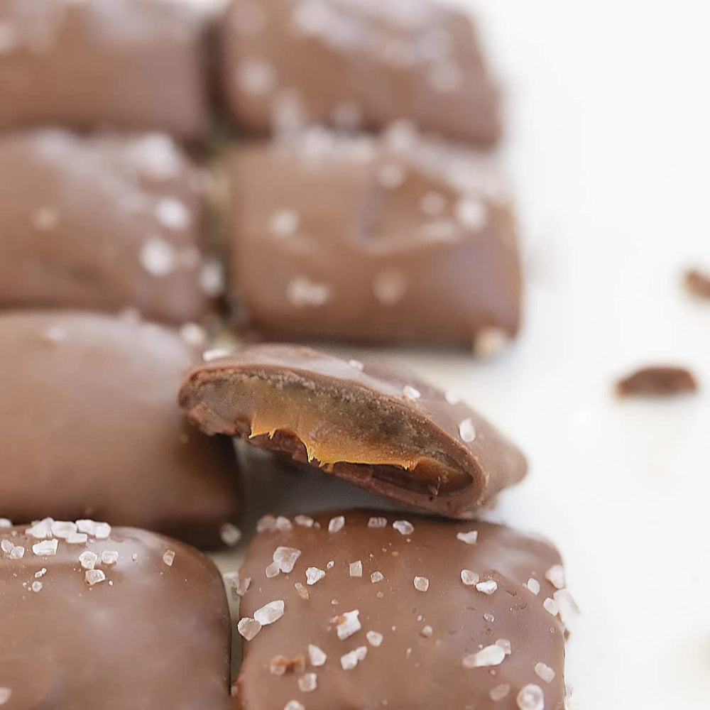 Close-up of Sanders THINS with smooth chocolate coating and caramel center.