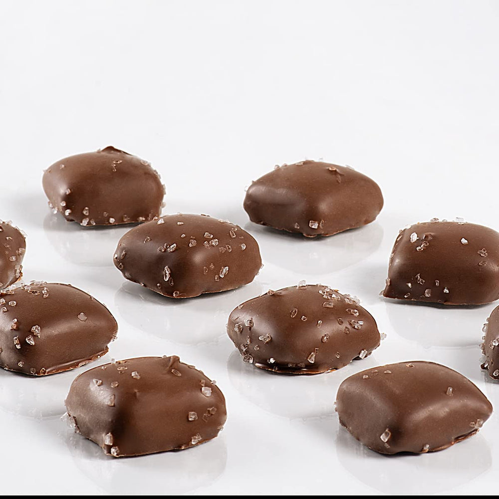 Sanders sea salt caramels bites with milk chocolate glaze, shareable indulgence.
