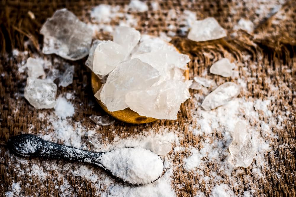 Sanniti alum powder in use demonstrates practical kitchen application