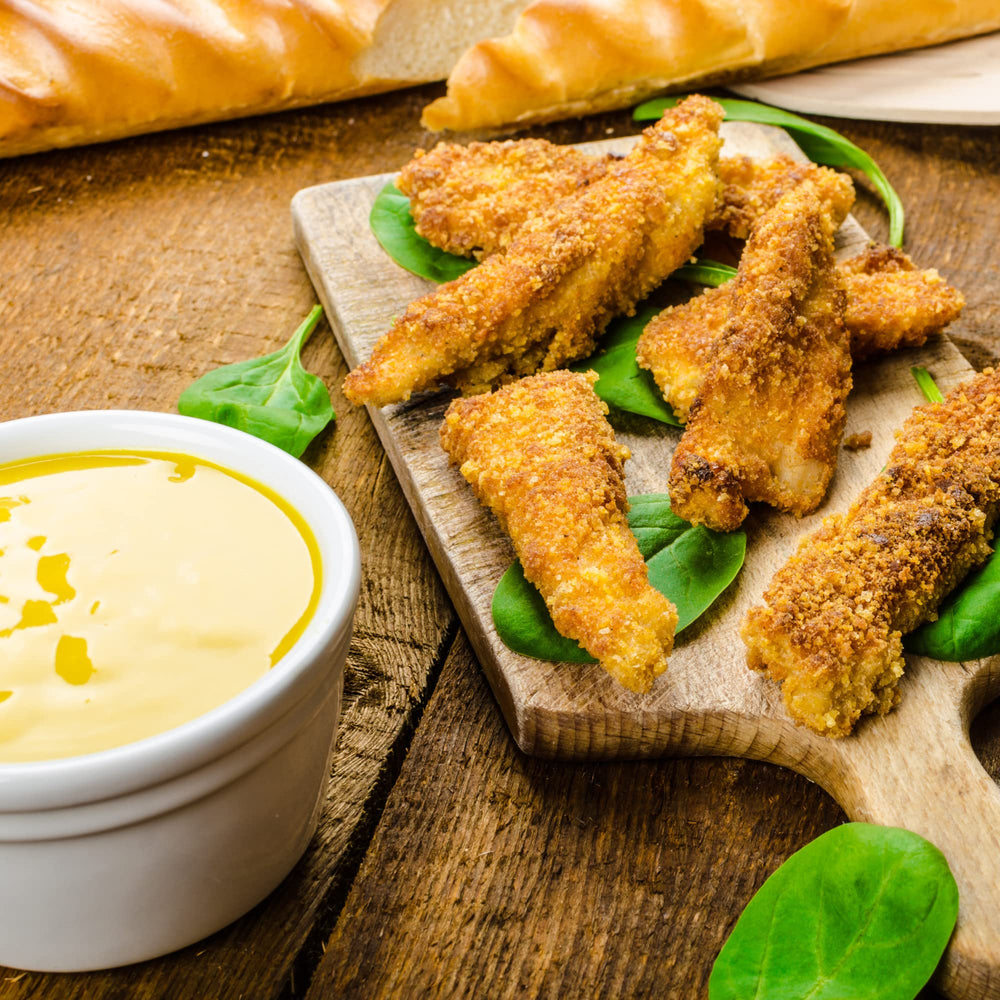 Sanniti Dijon Mustard jar on cheese board complements flavors.