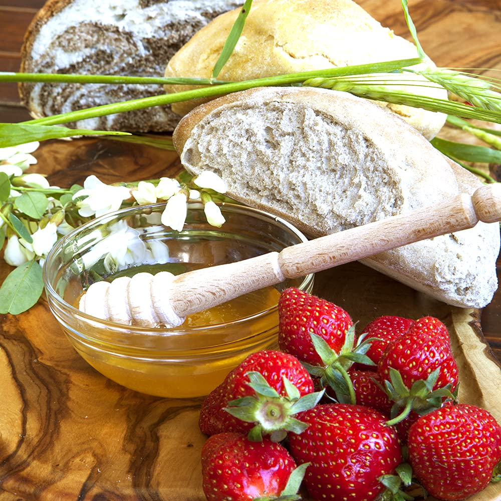Sanniti Fulmer Acacia honey with wooden spoon drizzle.