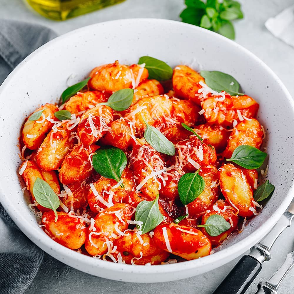 Sanniti gnocchi served with basil pesto, bright color and texture pairing.