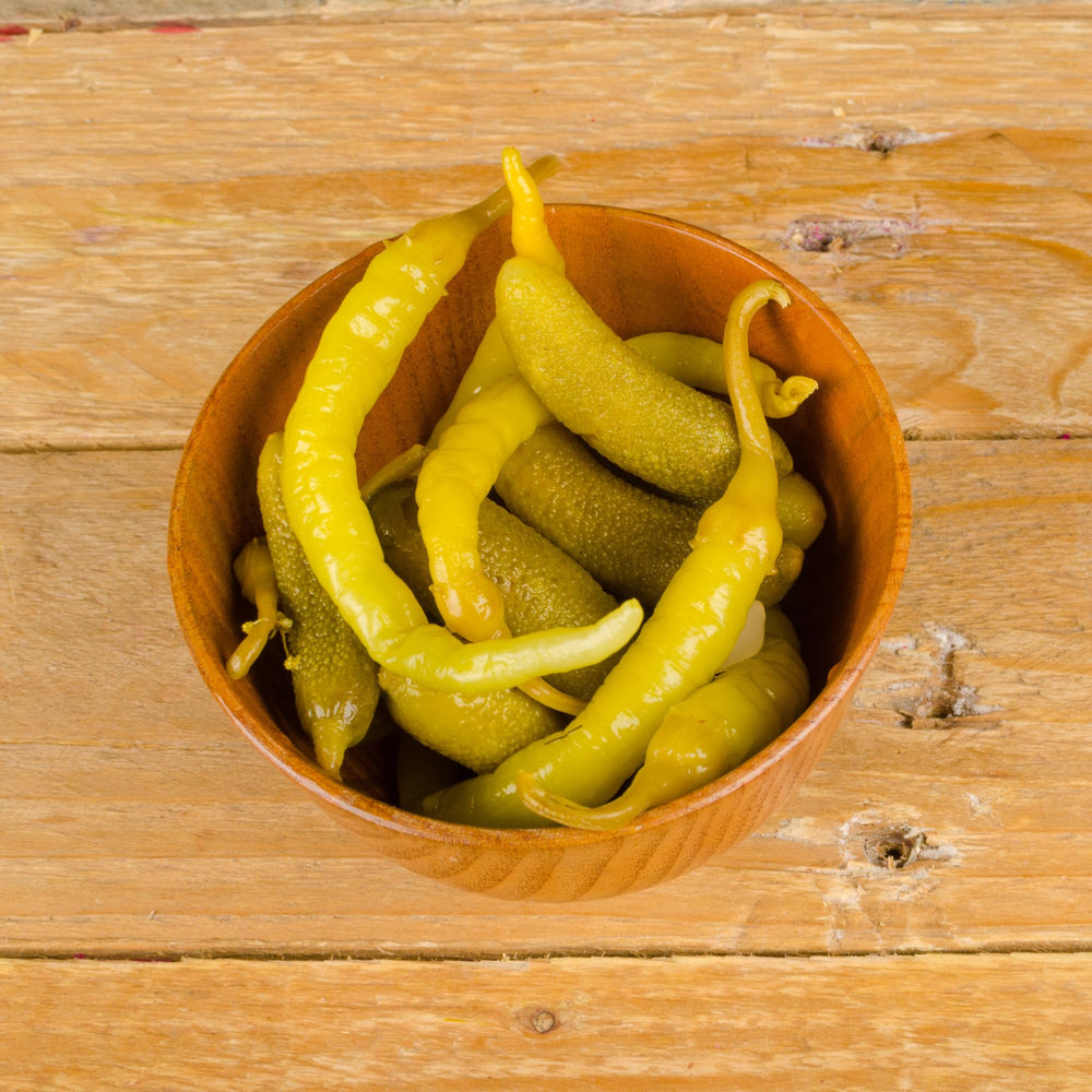 Sanniti Guindillas Piparras bottle on shelf, ideal gift for food lovers.