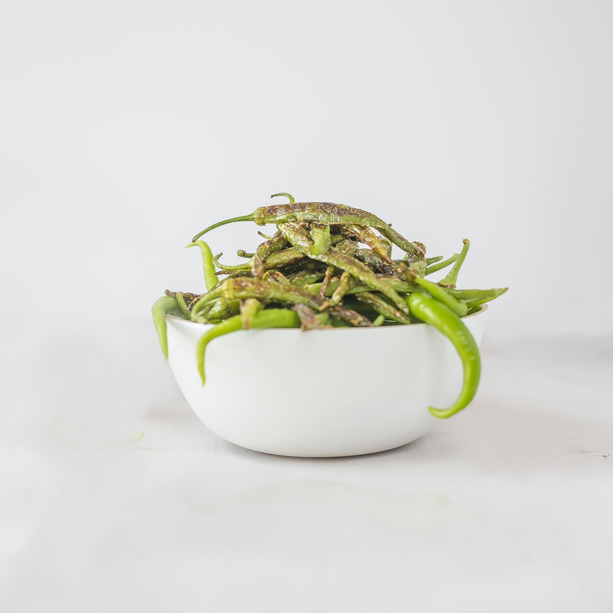 Sanniti Guindillas Piparras on kitchen scene, premium quality ingredient.