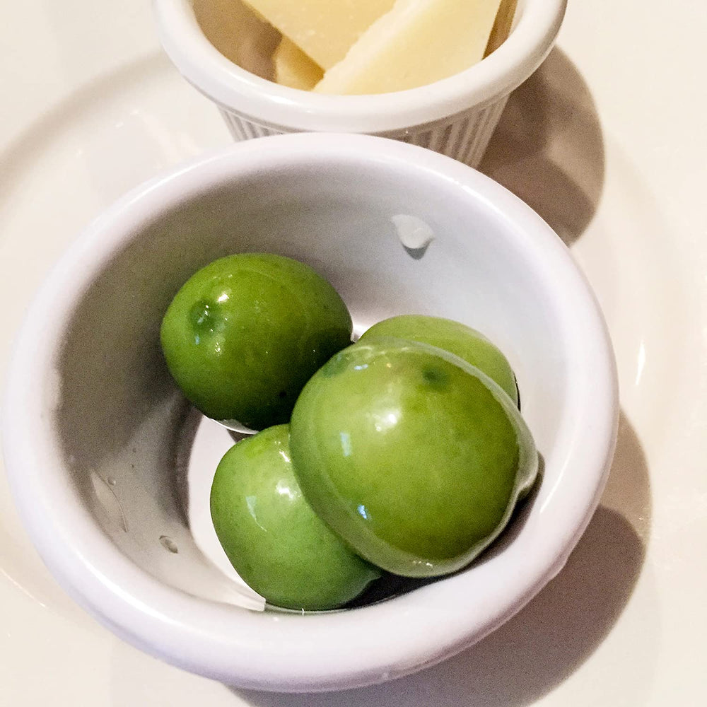 Sanniti olive jar label emphasizes Italian origin and quality.