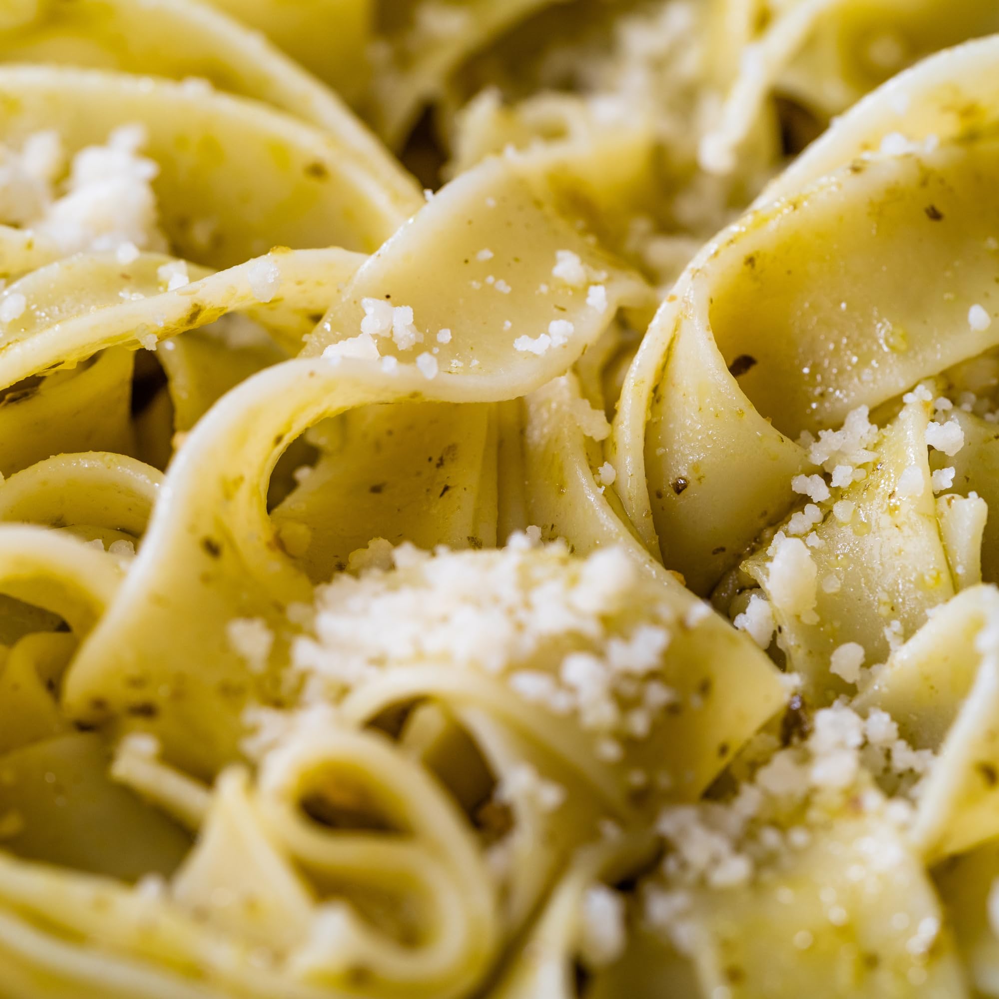Sanniti pappardelle wide ribbons dry on rack for hearty mushroom sauces.
