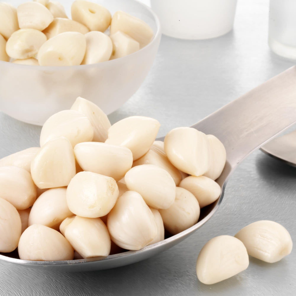 Sanniti pickled garlic with roasted meats enhances savory richness.