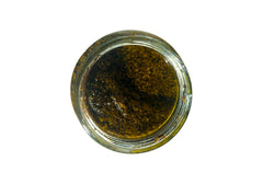 Sanniti Tartufata sauce spoon-dipping closeup suggests rich texture and aroma.