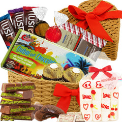 Sarah's Candy Factory heart-shaped gift basket featuring premium chocolates and cookies for a romantic surprise.