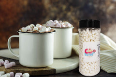 Jar of marshmallow bits over cereal bowl, convenient topping from Sarah's Candy Factory