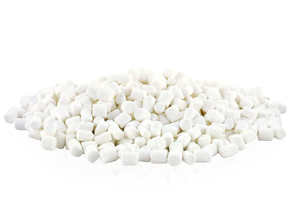 Vanilla dehydrated marshmallow bits sprinkled over hot chocolate.