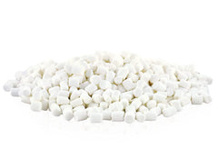 Vanilla dehydrated marshmallow bits sprinkled over hot chocolate.
