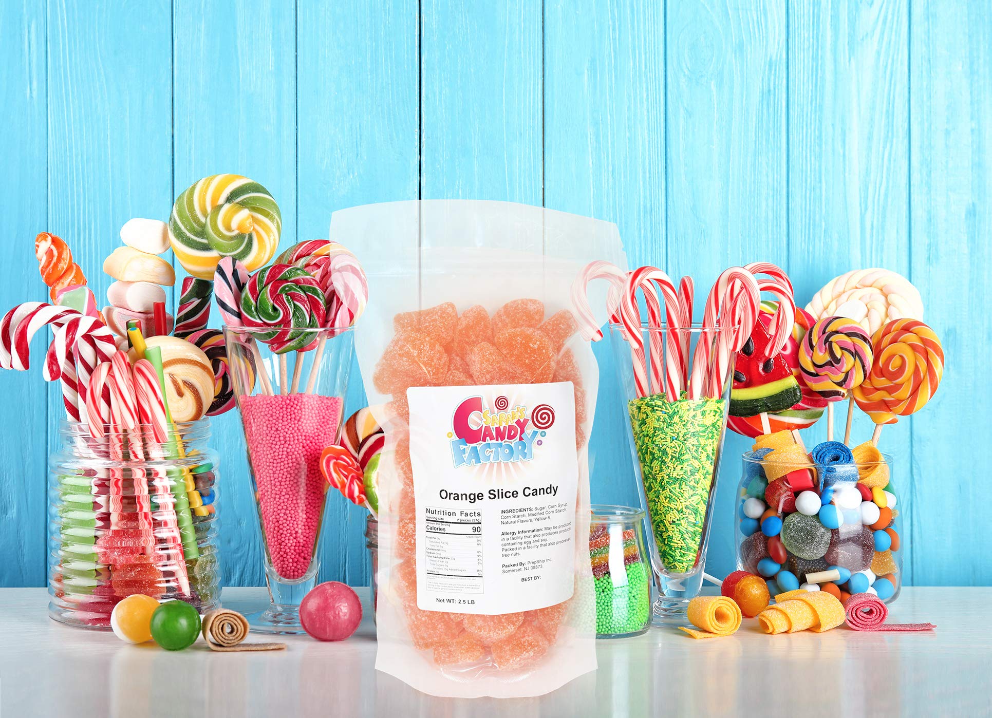 Sarah's Candy Factory orange slices close-up highlighting chewy texture and vibrant color.