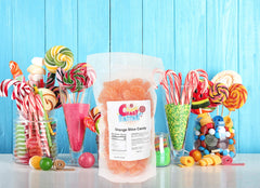 Sarah's Candy Factory orange slices close-up highlighting chewy texture and vibrant color.