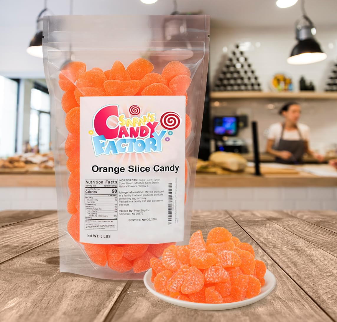 Sarah's Candy Factory resealable bag keeps orange slices gummies fresh between snacking.
