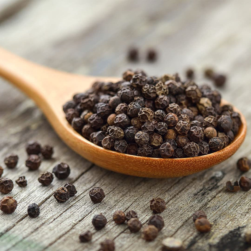 Sauer's Black Peppercorns in grinder delivering pungent aroma.