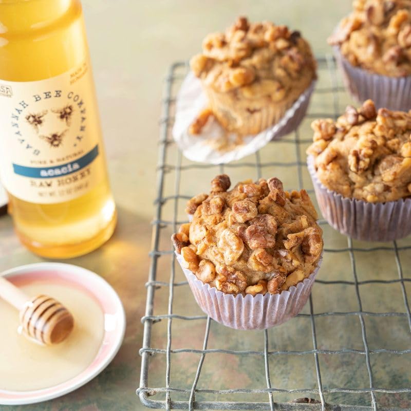 Savannah Bee honey drizzle over peaches, showcasing pairing of fruit and honey.