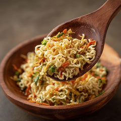 SavorSatch flakes in a soup bowl enhancing flavor and nutrients.