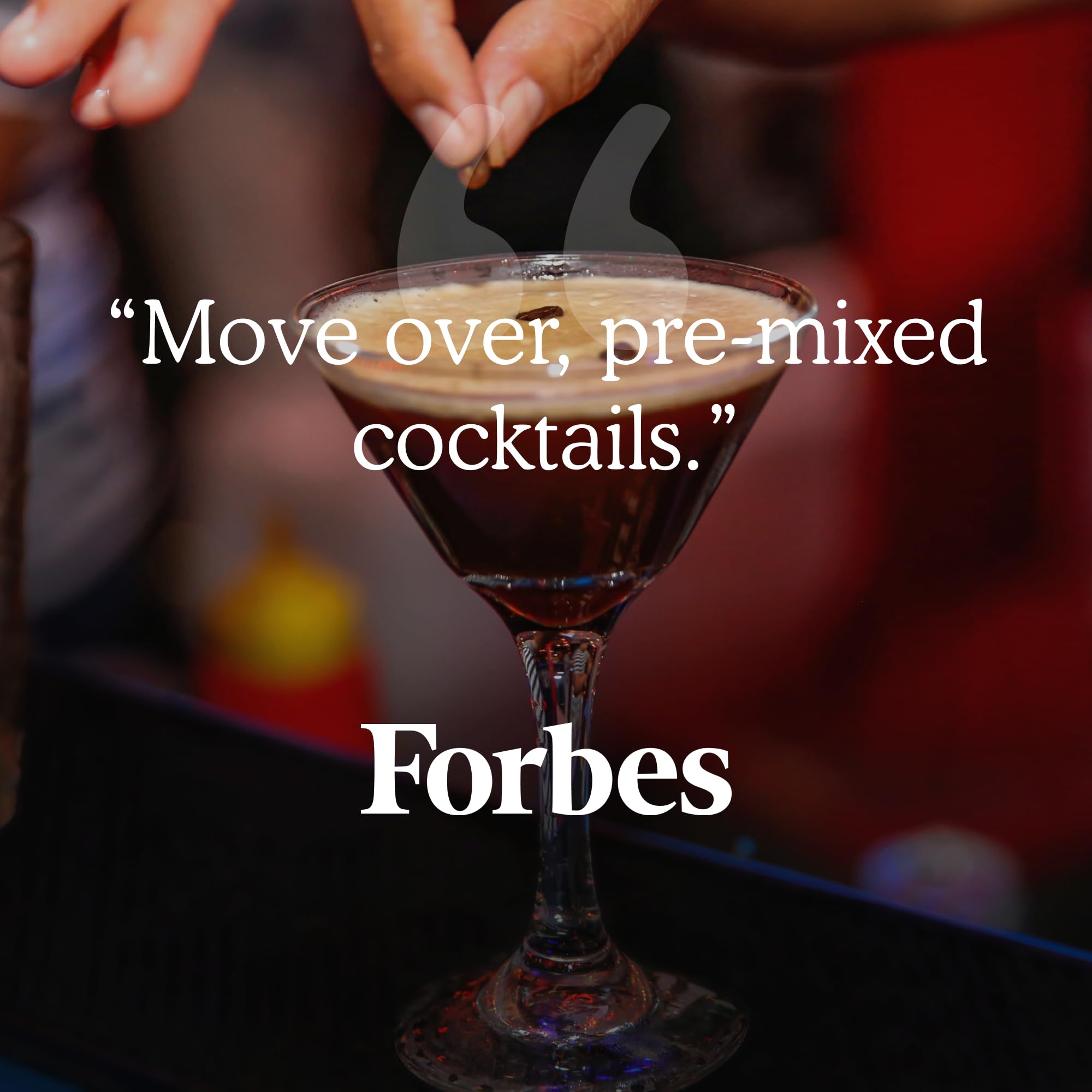 SaySO pouring espresso martini into ice-filled glass.