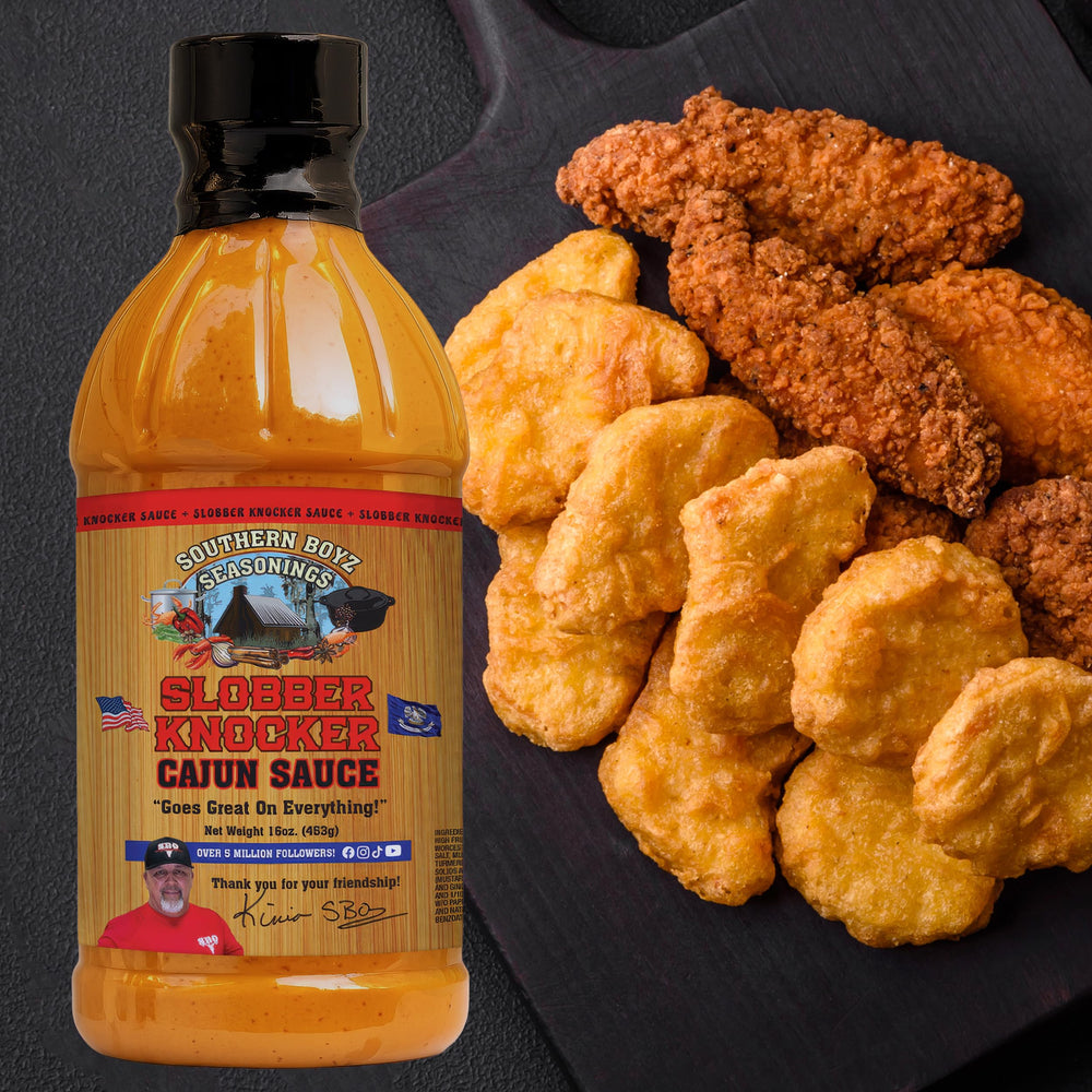 Seafood dish complemented by Slobber Knocker Cajun sauce from SBO.