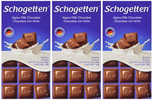 Schogetten Alpine Milk Chocolate pieces close-up, creamy texture and German craftsmanship.