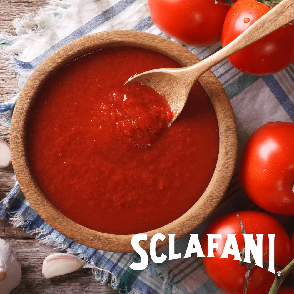 Pinch of salt detail on Sclafani crushed tomatoes enhances flavor.