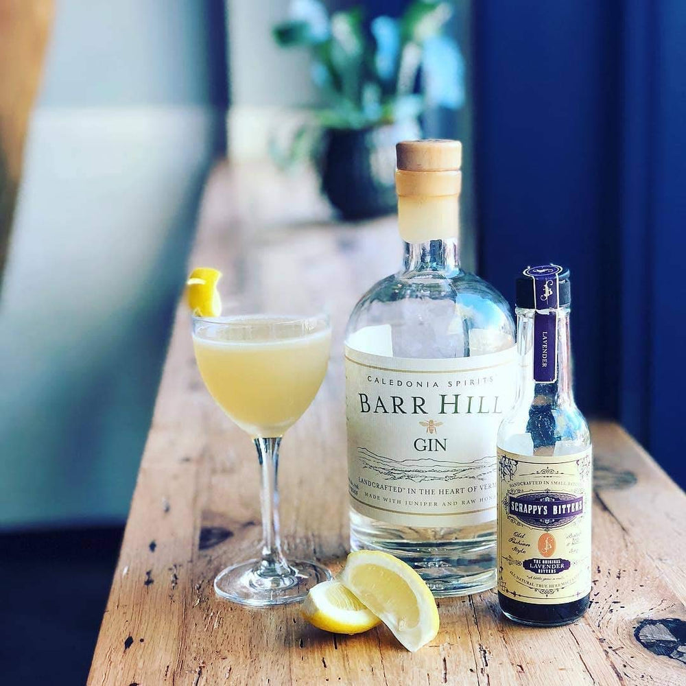 Scrappy's Lavender Bitters beside a prepared cocktail