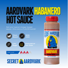 Secret Aardvark Habanero hot sauce being poured for versatile marinades.