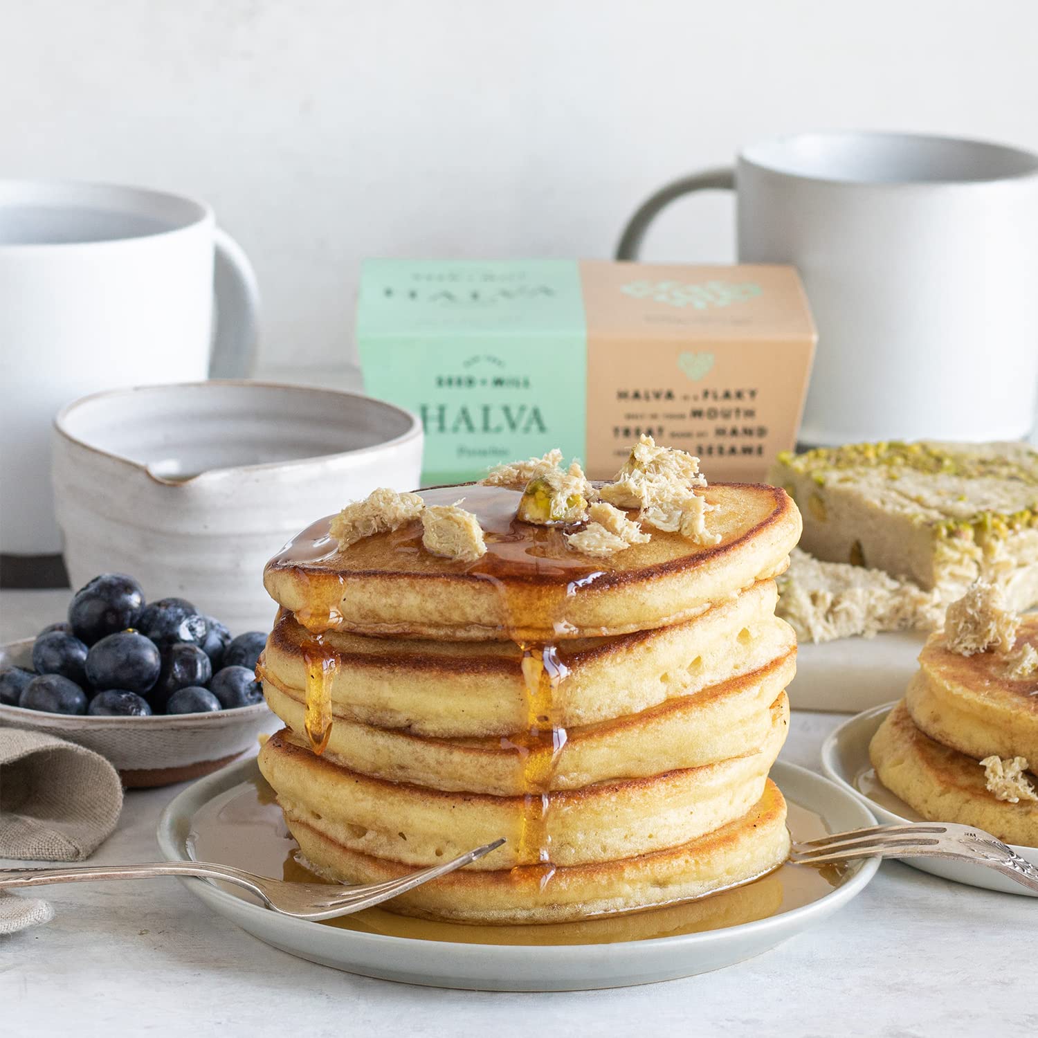 Seed + Mill halva crumble on yogurt illustrates versatile toping with nutty sweetness.