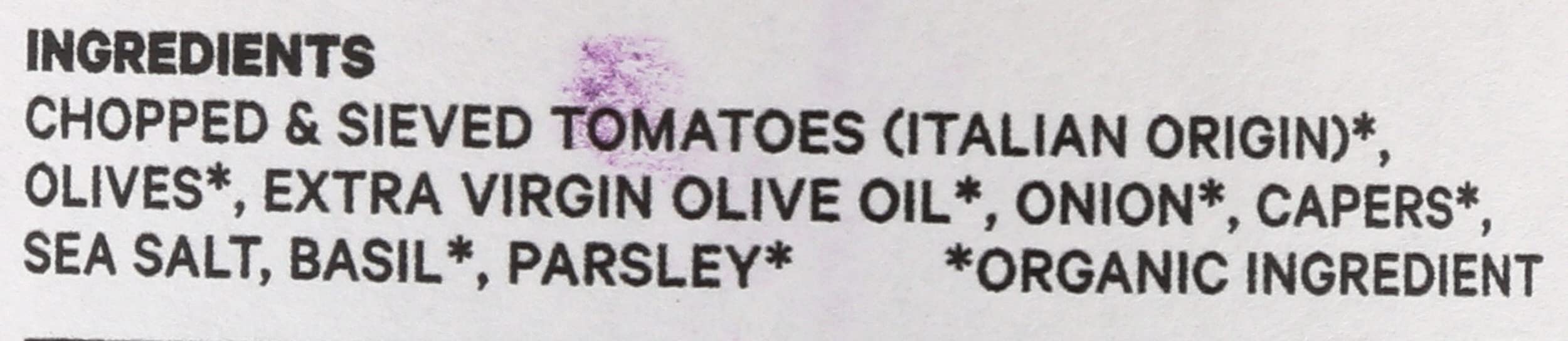 Seggiano puttanesca sauce ingredients close-up showing olives and capers contributing bold flavor.